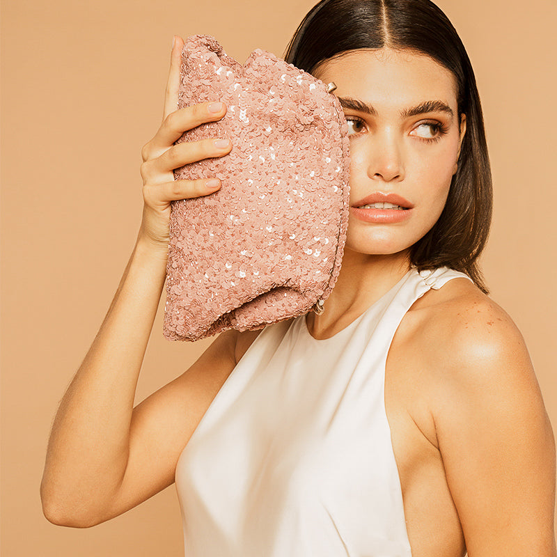 Model carrying Deepa Gurnani handmade Hermia Clutch Dusty pink color