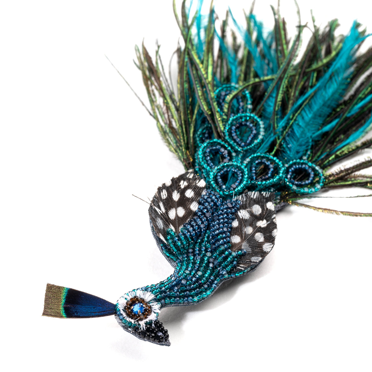 Detail of Deepa Gurnani handmade Peacock brooch in green color