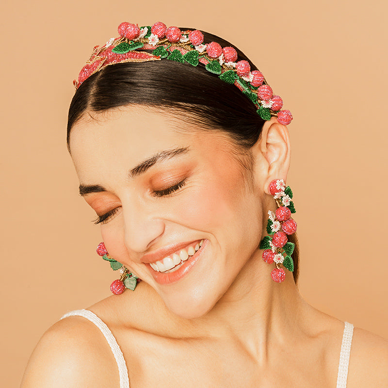 Model Wearing Deepa Gurnani handmade Gloriosa Headband in Magenta color