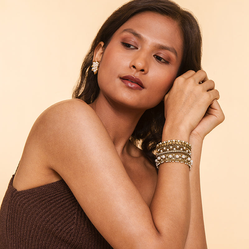 Model Wearing Deepa by Deepa Gurnani Handmade Orion Bracelet in gold color