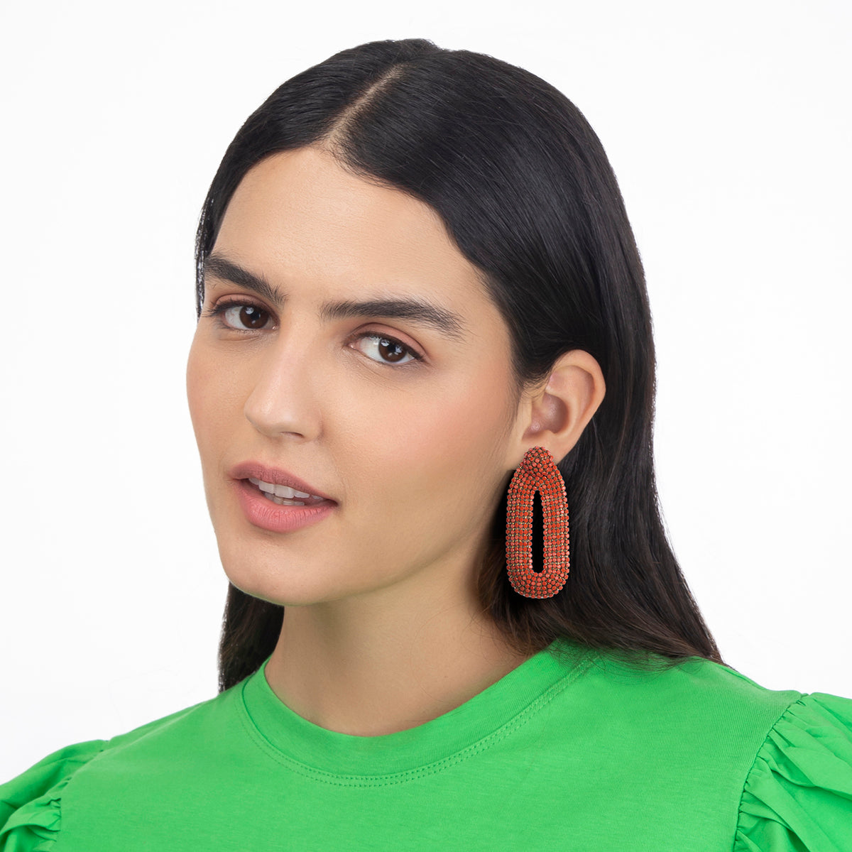 Model wearing our light weight Bianca Earrings are handmade with glass crystals in an oval drop shape.