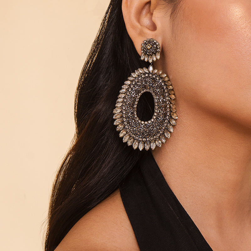 Detail of Model wearing Deepa Gurnani Handmade Kiki Earrings in Gunmetal