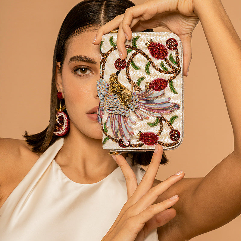 Model carrying Deepa Gurnani handmade Birdie Clutch in White Color