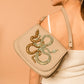 Model carrying Deepa Gurnani handmade Savile Handbag in Turquoise color