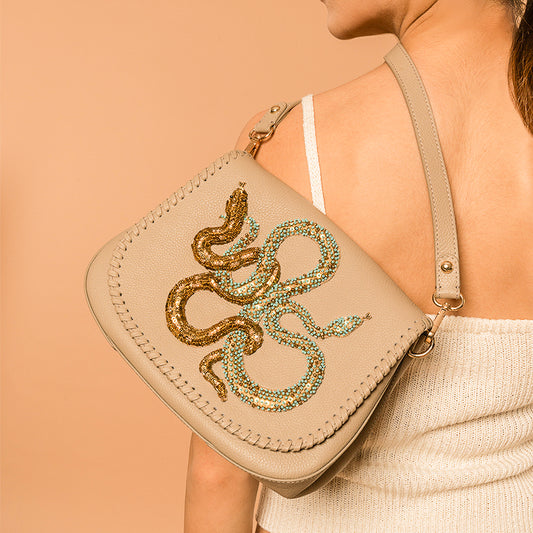 Model carrying Deepa Gurnani handmade Savile Handbag in Turquoise color