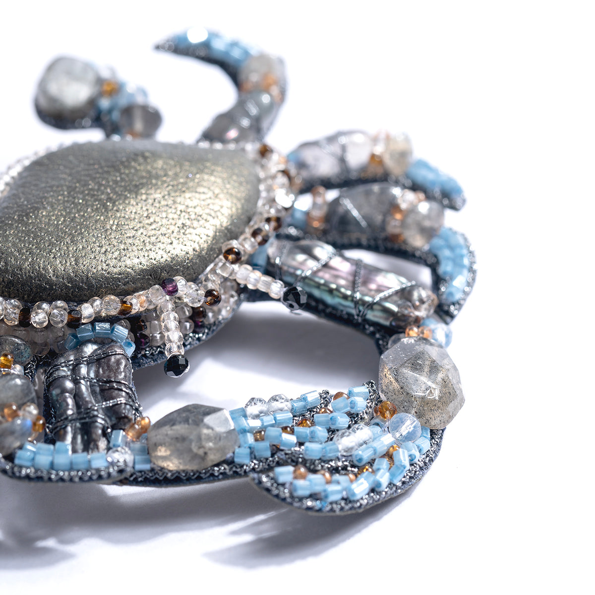 Detail of Deepa Gurnani handmade Crab brooch in blue color