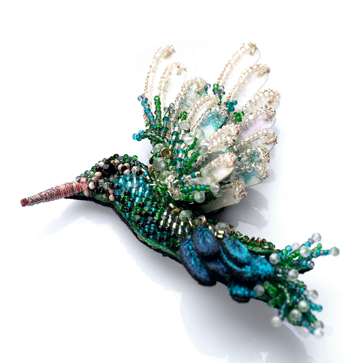 Detail of Deepa Gurnani handmade Hummingbird brooch in emerald color