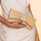 Model Carrying Deepa Gurnani Handmade Aviana Clutch in gold colour