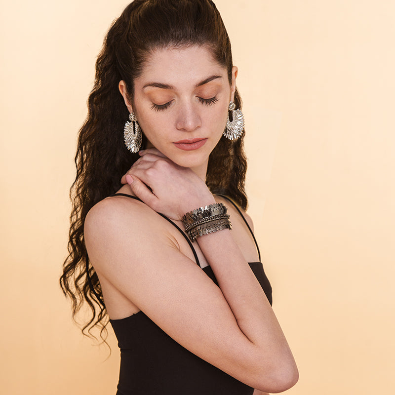 Model wearing Handmade Deepa by Deepa Gurnani Silver color Posha Earrings and Gunmetal color Chiara Cuff