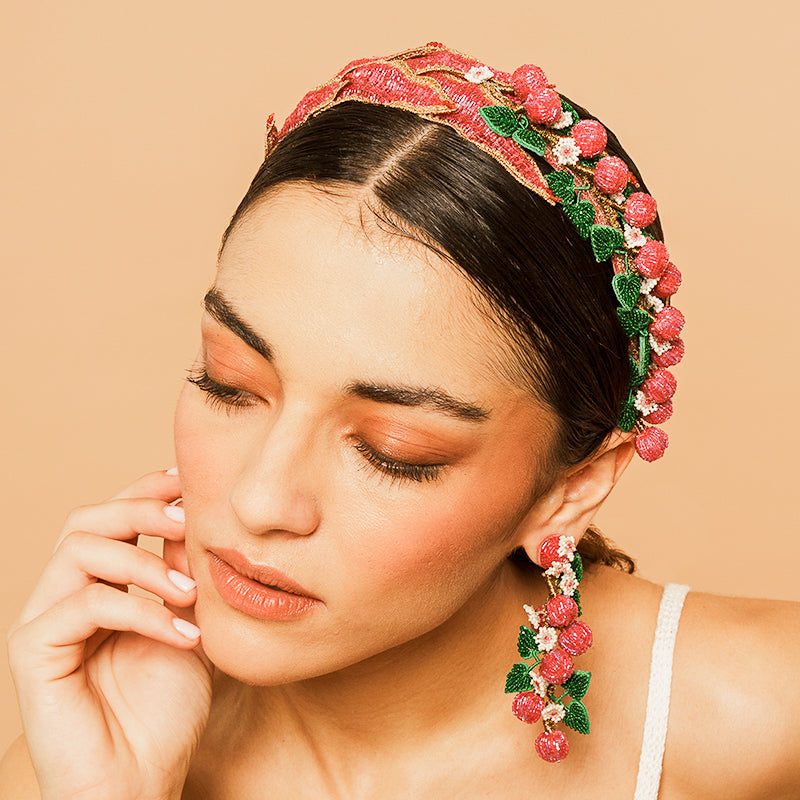 Model Wearing Deepa Gurnani handmade Gloriosa Headband in Magenta color