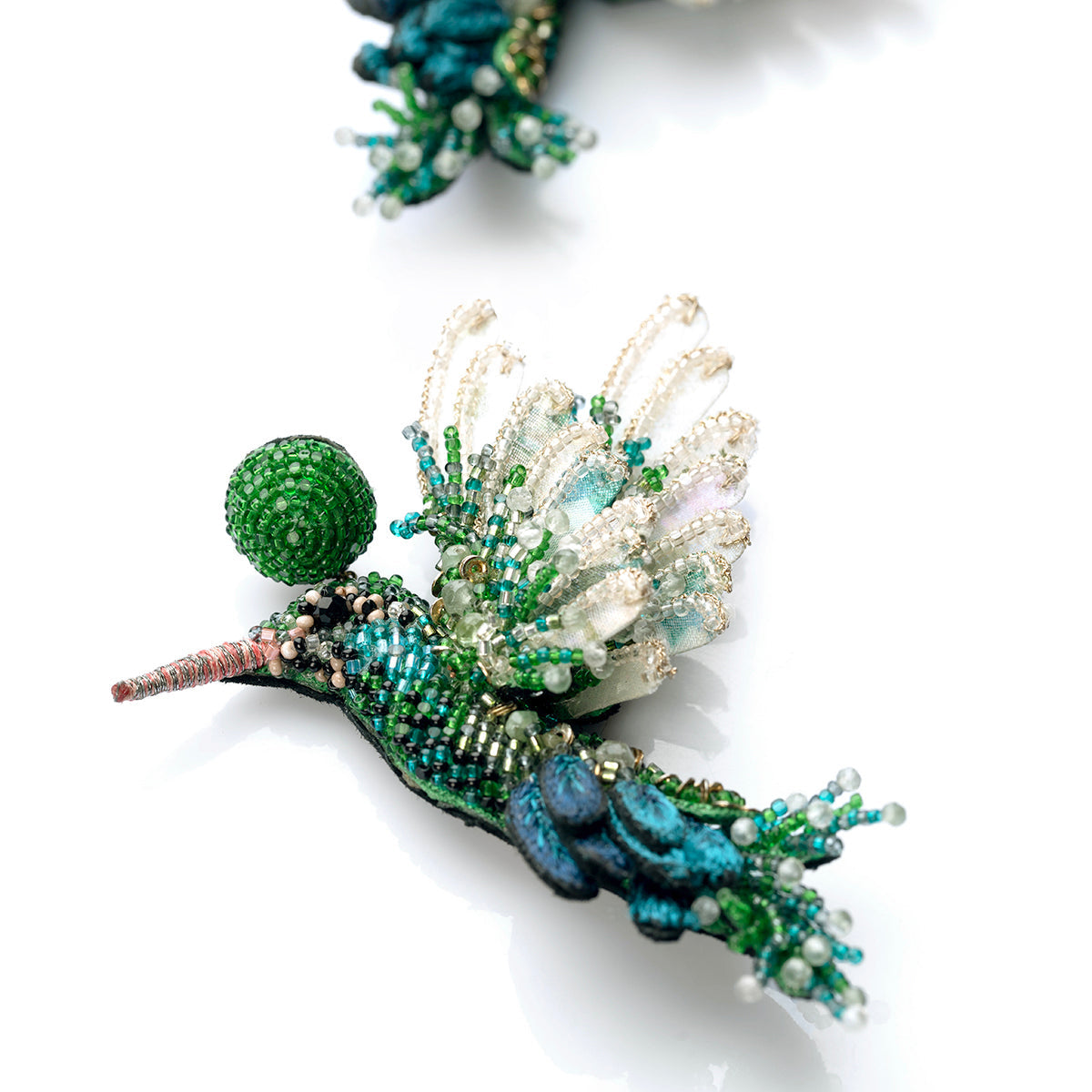 Detail of Deepa Gurnani Handmade Green Hummingbird Earrings