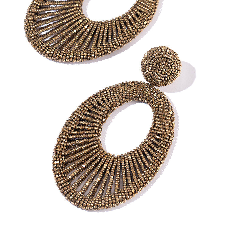 Detail of Deepa Gurnani Handmade Cypress Earrings in Antique Gold color