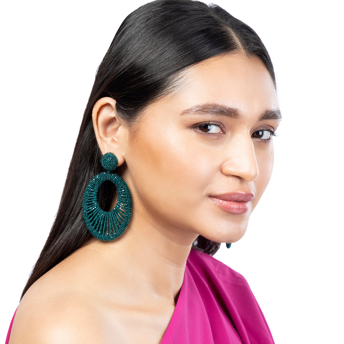 Model wearing Deepa Gurnani Handmade Cypress Earrings in Emerald color