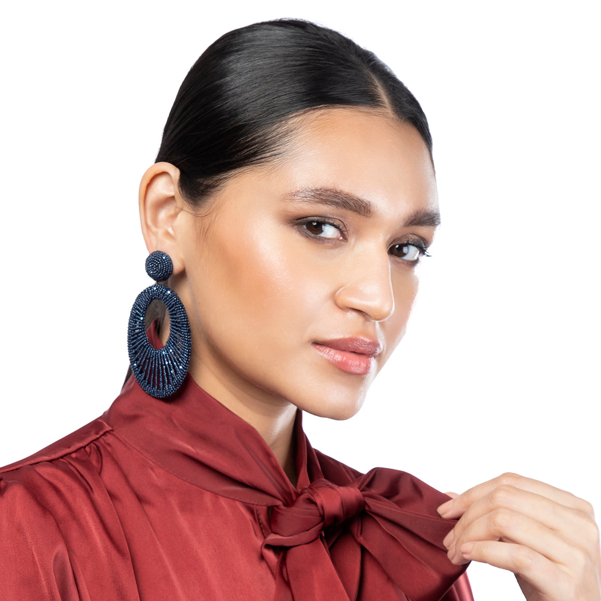 Model wearing Deepa Gurnani Handmade Cypress Earrings in Navy color