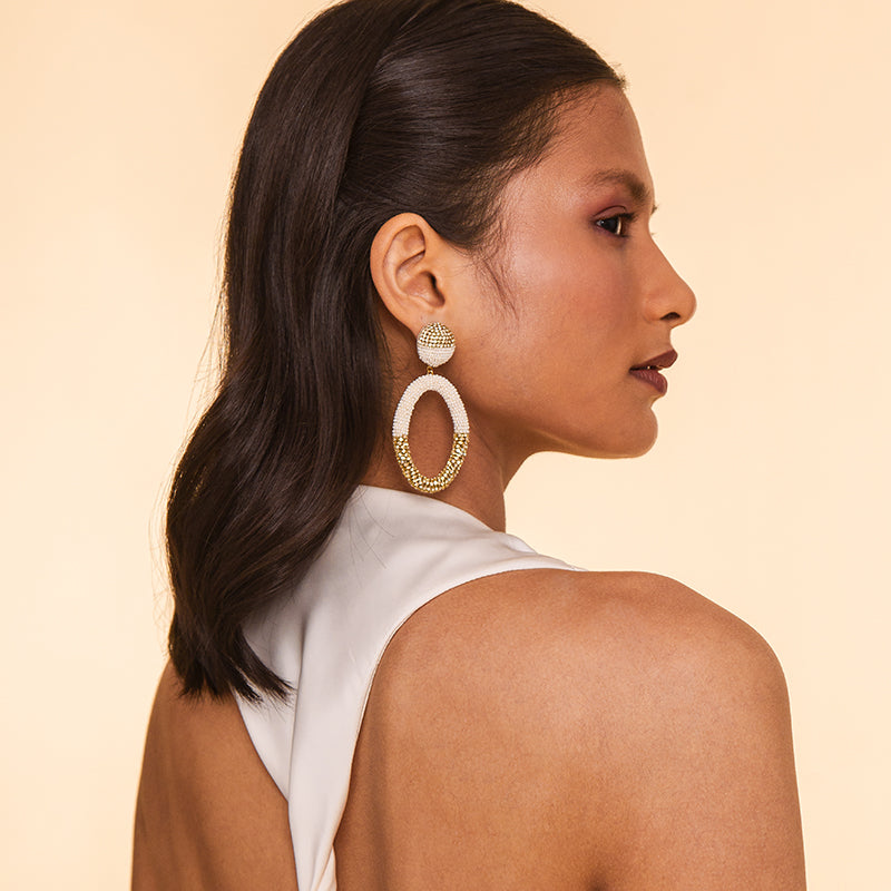 Model wearing Deepa Gurnani handmade Lorette Earrings in Ivory color