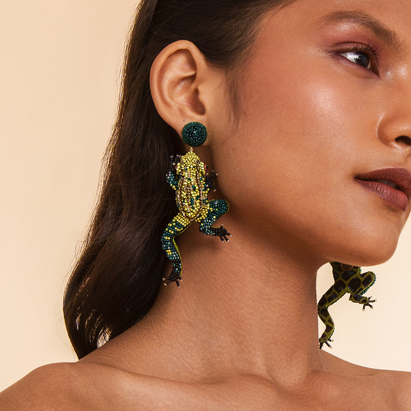 Model wearing Deepa Gurnani handmade Frog Earrings in Green color