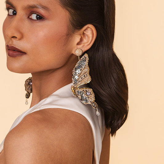 Detail of Model wearing Deepa Gurnani Handmade Arcadia Earrings in Beige color