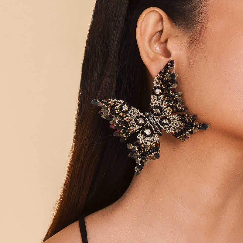 Detail of Model wearing Deepa Gurnani Handmade Eyvette Earrings in Black color