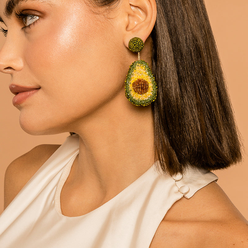 Model Wearing Deepa Gurnani handmade Avocado Earrings in Green color