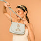Model carrying Deepa Gurnani handmade Queen Bee Handbag in Powder Blue color