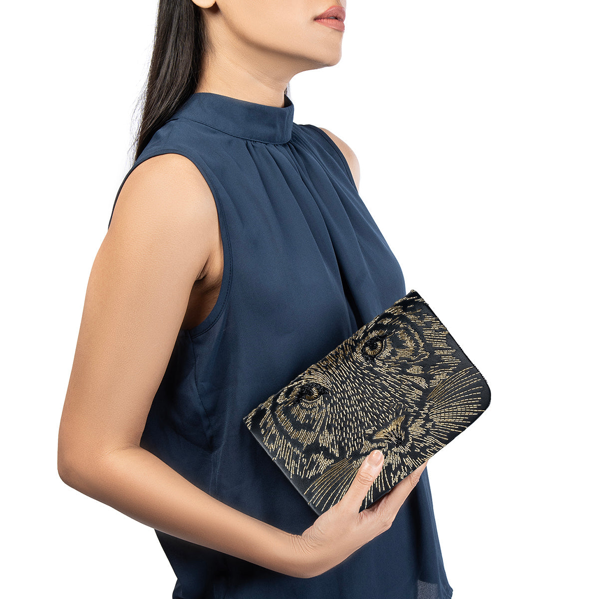 Model carrying Deepa Gurnani  Adonis Clutch in Gold color