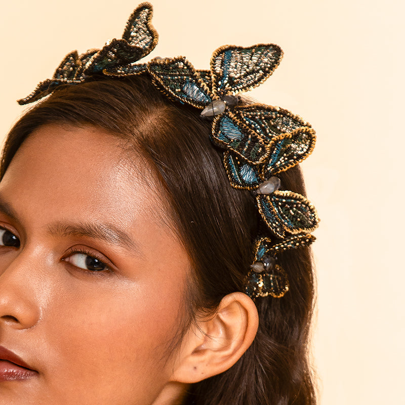 Model wearing Deepa Gurnani handmade Larissa headband in Teal color